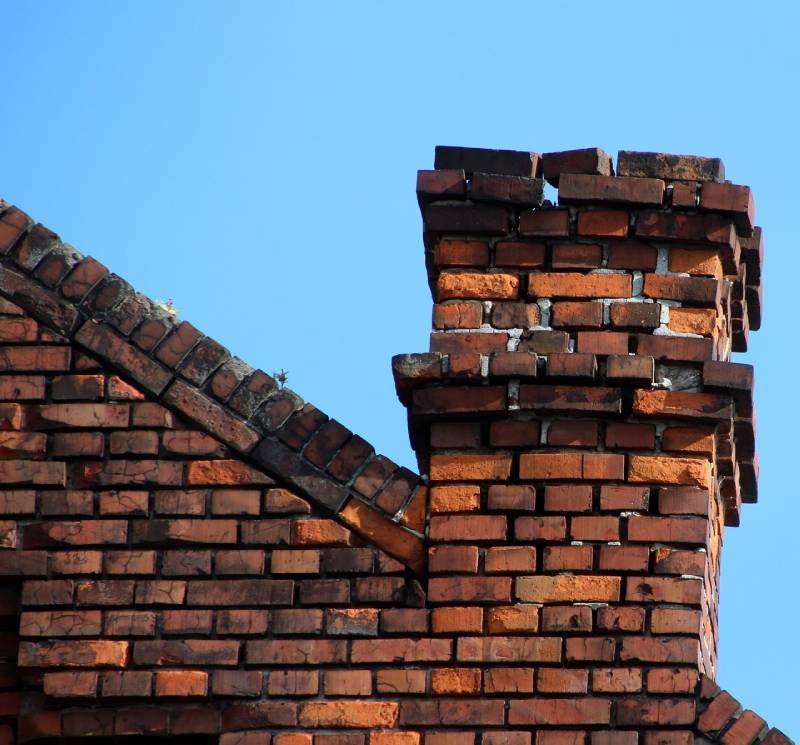 Damaged chimney on an Mayo home showing cracks and missing mortar